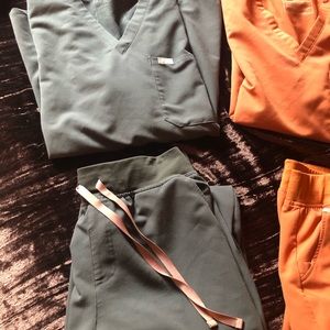3 sets of figs and 1 set of carhartt scrubs